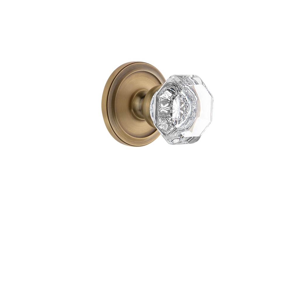Grandeur Hardware Grandeur Circulaire Rosette Double Dummy with Chambord Crystal Knob in Vintage Brass